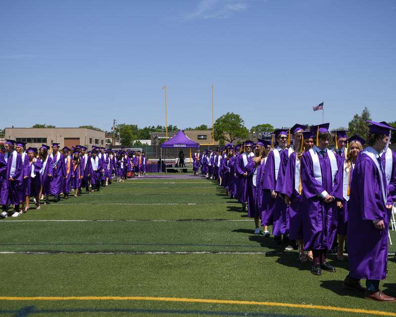 Downers Grove North graduates make their way to their seats during the Processional portion of the graduation held on Sunday May 19, 2024, at Downers Grove North High School.