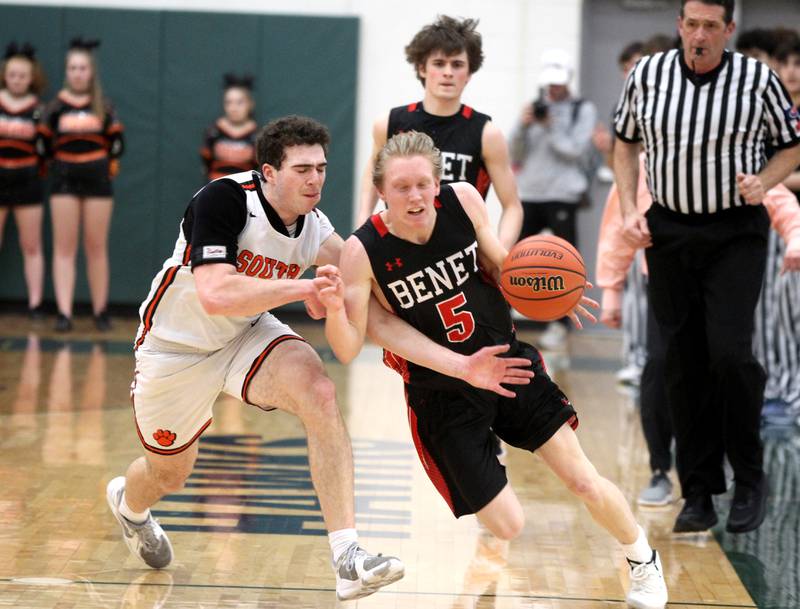 Ben Romanesko (5) dribbles away from Wheaton Warrenville South’s Tyler Fawcett during a Class 4A Bartlett Sectional semifinal game on Wednesday, March 2, 2022.