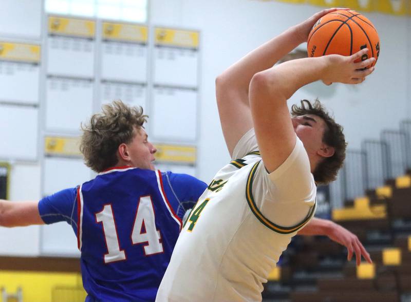 Crystal Lake South’s Johnathan Morgan, front, shoots as Lakes’ Dylan McCann defends in varsity boys basketball Hinkle Holiday Classic action on Friday, Dec. 26, 2025, at Jacobs High School in Algonquin.