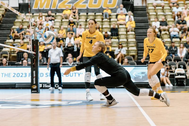 Maya Sands dives for a ball in a volleyball match vs. Colgate in 2023 (photo courtesy of University of Missouri athletics department).