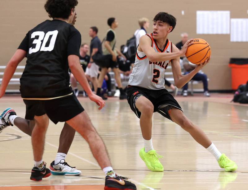 DeKalb’s Aaron Ziga looks to pass the ball Friday, June 20, 2025, during their game against Streamwood in the DeKalb Live summer tournament at DeKalb High School.