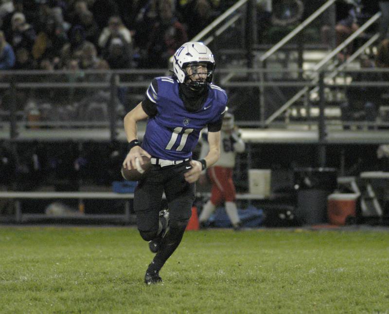 Dixon Quarterback Jagger Kemp loks downfield. Genoa-Kingston traveled to Dixon to take on the Dukes. The game took place on Dixon's Senior Night, October 24th, 2025