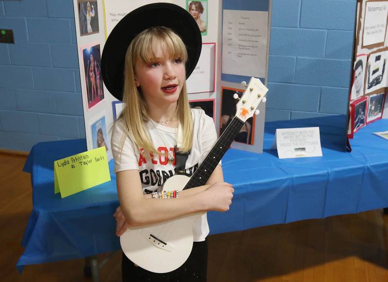 Third grader Lydia Petritsch, portraying Taylor Swift, gives her presentation during the Hinckley Big Rock Elementary School Wax Museum Thursday, March 13, 2025, at the school in Hinckley.