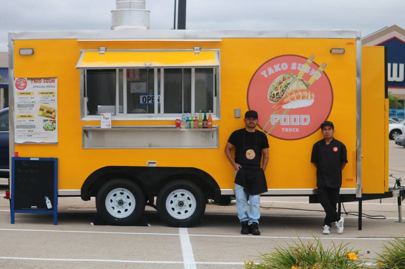 Juan Martín Muñoz and Frederick Abarca, two of the owners from Tako Sushi Food Truck, are shown standing in front of their food truck Aug. 6, 2024.