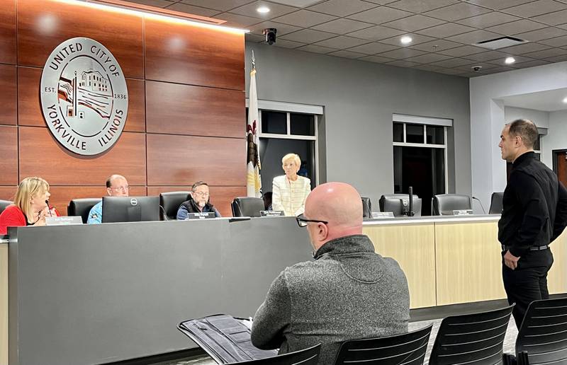 Sammy Hall (far right), a potential candidate for Yorkville's Ward 4, presents his case against an objection to his nominating petition by his potential opponent Lowell "Rusty" Hyett before an electoral board on Nov. 26.