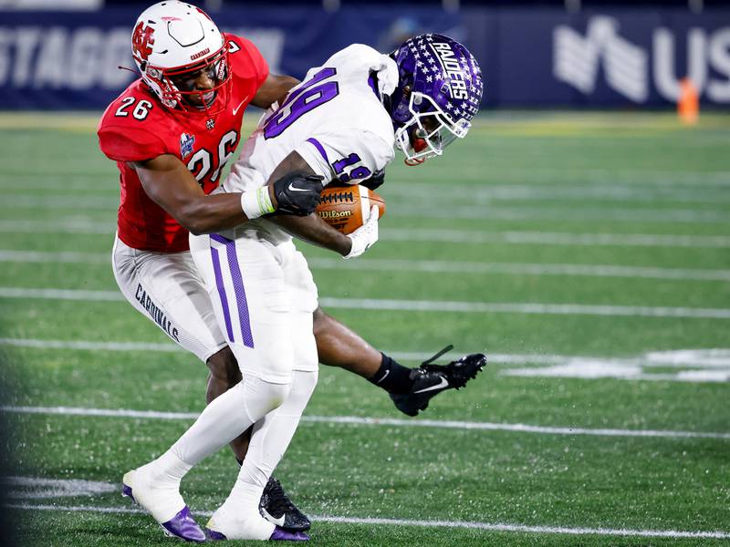 North Central College cornerback Antwain Walker, an Oswego East graduate, makes a tackle during the Stagg Bowl win over Mount Union to win the Division III National Championship on Dec. 16, 2022.
