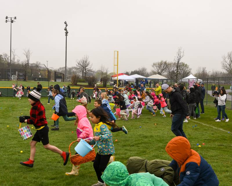 Participants sprint to collect Easter eggs on Saturday April 19, 2025, held at Berens Park in Elmhurst.