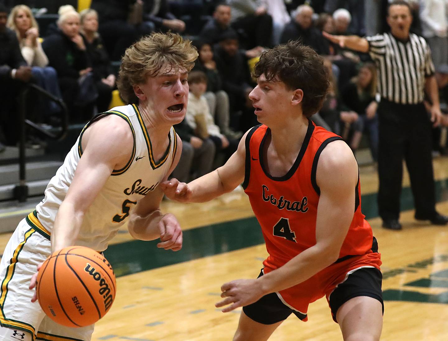 Crystal Lake South's Carson Trivellini drives the baseline against Crystal Lake Central's Bud Shanahan during an IHSA Class 3A Crystal Lake South Regional boys basketball semifinal game on Wednesday, February, 25, 2026, at Crystal Lake South High School.