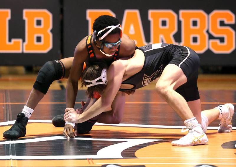 DeKalb’s Jaden Bradley (top) and Sycamore’s Carson West wrestle Friday, Jan. 17, 2025, during their 106 pound match at DeKalb High School.