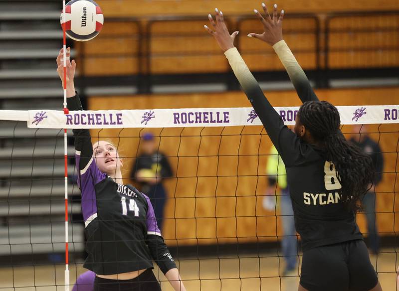 Dixon’s Leah Carlson tries to get the ball by Sycamore's Khiara Thomas Thursday, Oct. 30, 2025, during their Class 3A regional championship match in Rochelle