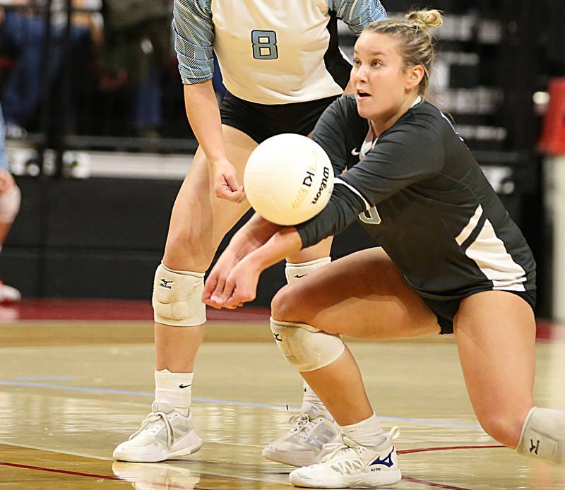 Joliet Catholic's libero Allie Wuestenfield saves the ball against St. Francis in the Class 3A semifinal game on Friday, Nov. 11, 2022 at Redbird Arena in Normal.