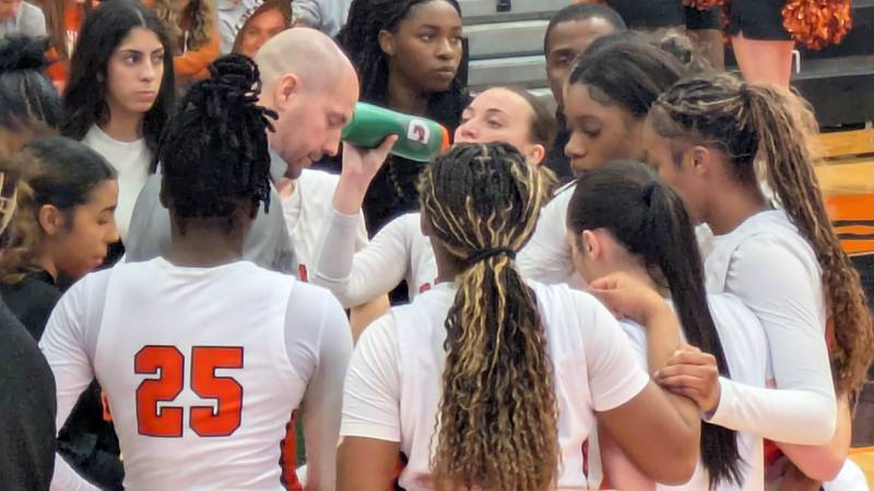 DeKalb coach Bradley Bjelk talks to his players during a timeout on Tuesday, February 11, 2025 against Metea Valley in the Barbs' 43-35 home win.