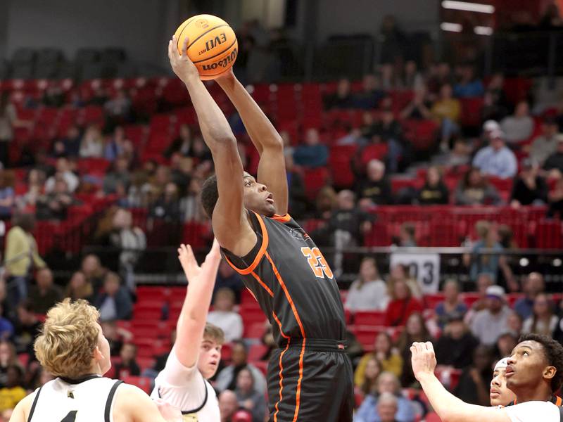 DeKalb's Davon Grant grabs a rebound in front of two Sycamore defenders during their game Friday, Jan. 31, 2025, in the FNBO Challenge in the Convocation Center at Northern Illinois University in DeKalb.