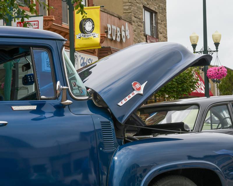 The hood of a 1956 Ford F100 is open to display the motor during the 24th annual Fizz Ehrler Memorial Turning Back Time Car Show in downtown Sycamore on Sunday, July 28, 2024.