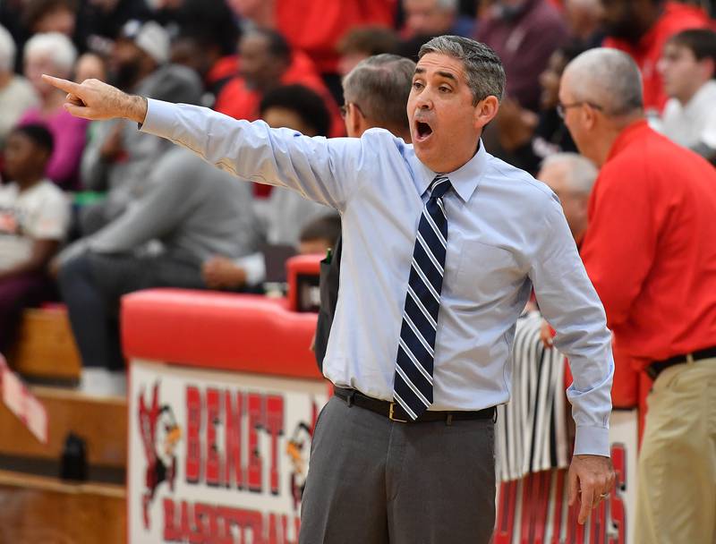 Newly named Hall of Fame Benet boys basketball coach Gene Heidkamp shouts instructions to his team during a game against Marist on Friday, Dec. 13, 2024 at Benet Academy in Lisle.