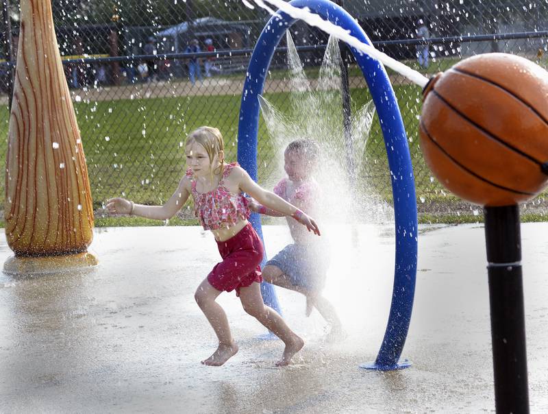 The Peck Park Splash Pad came in handy to cool of children during National Night Out Tuesday Evening in Ottawa.