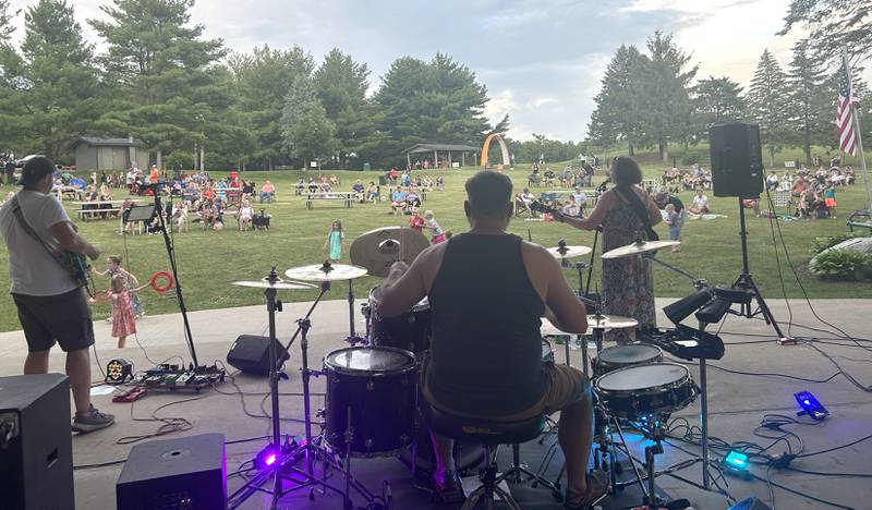 Families sit and listen to the music of “Buzzed by SonSET,” at the Oregon Park District’s Concert in the Park on Tuesday, June 24. The free concerts are held Tuesday nights at Oregon Park West.