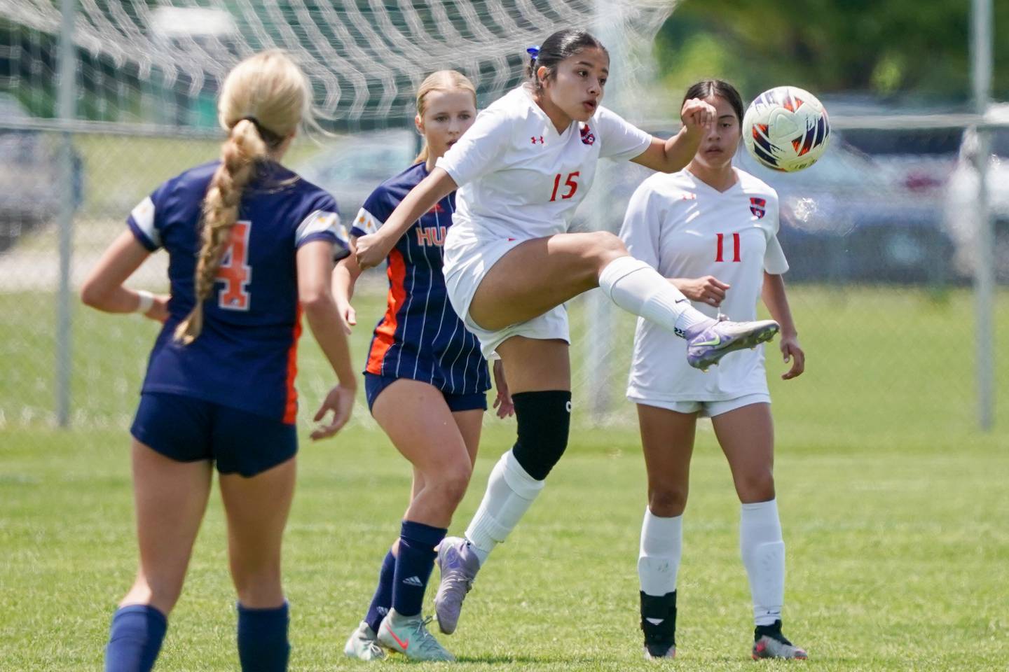 Oswego’s Destany Luna (15) plays the ball against Naperville North during a class 3A Oswego regional final match at Oswego High School on Saturday, May 24, 2025.