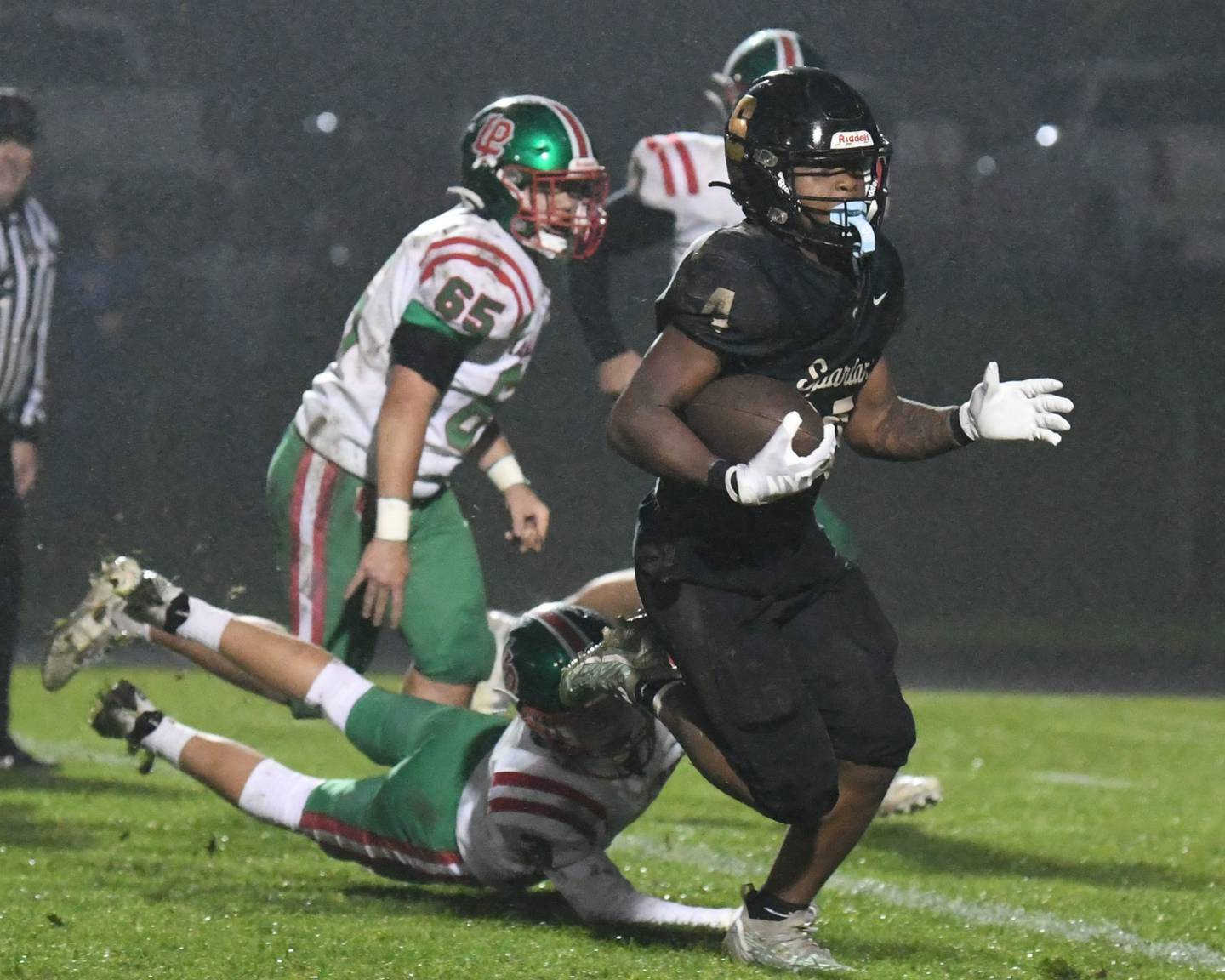 Sycamore Tyler Curtis (4) gets past LaSalle-Peru Michael Hartman (3) for a touchdown during the first half the game on Friday Oct. 13, 2023, held at Sycamore High School.