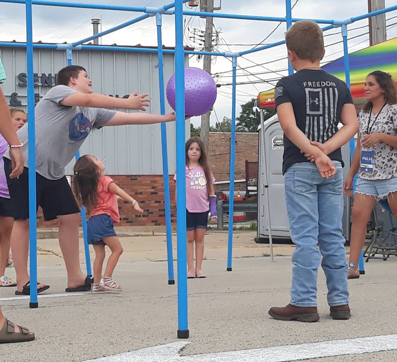 Children play a game Wednesday, Aug. 3, 2022, at Shipyard Days in Seneca similar to volleyball set up by the Village Church.