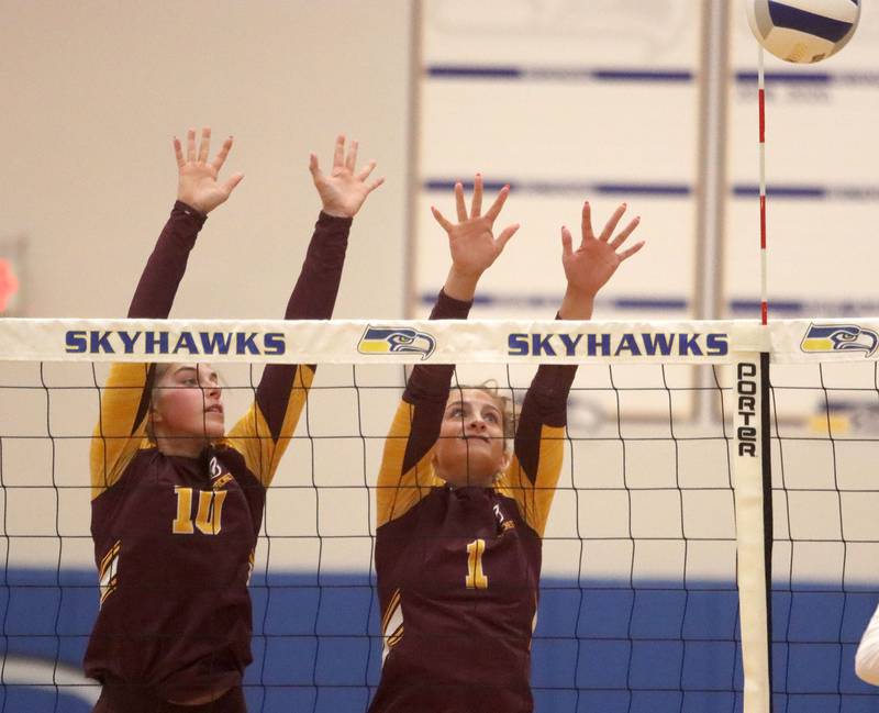 Richmond-Burton’s Daniella Mazzola, left, and Sophia Komar block in varsity girls volleyball at Johnsburg High School in Johnsburg on Thursday, August 25, 2025.