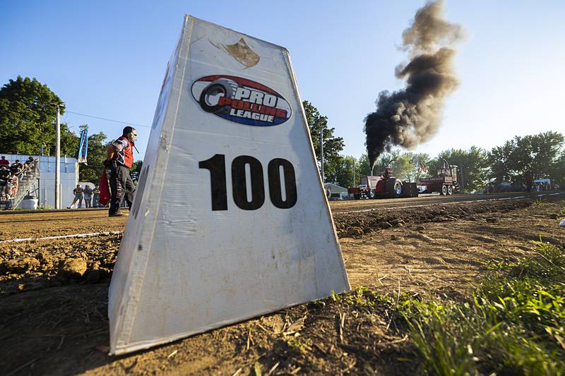 Craig Hol fires up his light limited super-stock tractor for pulling action Wednesday, Aug. 7, 2024, at the Carroll County Fair. The Badger State Tractor Pullers always bring in a nice crowd to witness the high-horsepower performance.