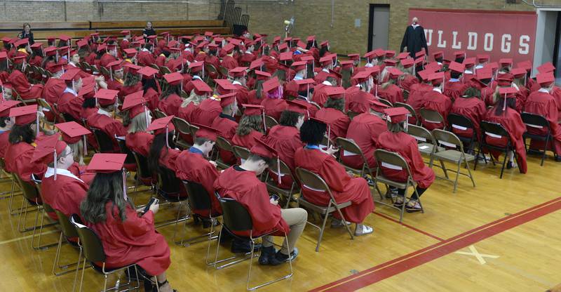All 185 of the Streator High School Class of 2022 wait and receive instructions inside the Bloomington Street gym prior to marching into Pops Dale Gymnasium to receive their diplomas Sunday, May 22, 2022.