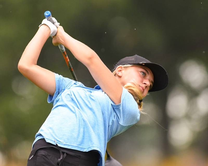 Ariana Savenok of Wheaton North watches her ball in flight after teeing off during the DuKane conference meet on Tuesday Sept. 23, 2025, held at Phillips golf course in Aurora.