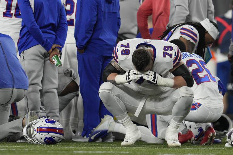 Buffalo Bills lineman Spencer Brown reacts as teammate Damar Hamlin receives medical attention after collapsing during the first half against the Cincinnati Bengals, Monday, Jan. 2, 2023, in Cincinnati.