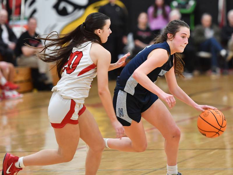 Nazareth’s Sophia Towne drives as Benet’s Sailer Jones (left) defends during a game on January 29, 2025 at Benet Academy in Lisle.