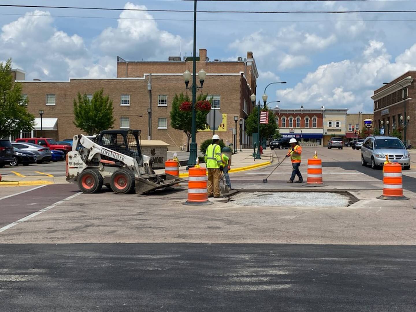 Crews work along DeKalb Avenue in Sycamore on Thursday, July 6, 2023. Water main and road work on DeKalb Avenue has been going on since mid-April 2023, with detours near downtown Sycamore at DeKalb Avenue and Cross Street.