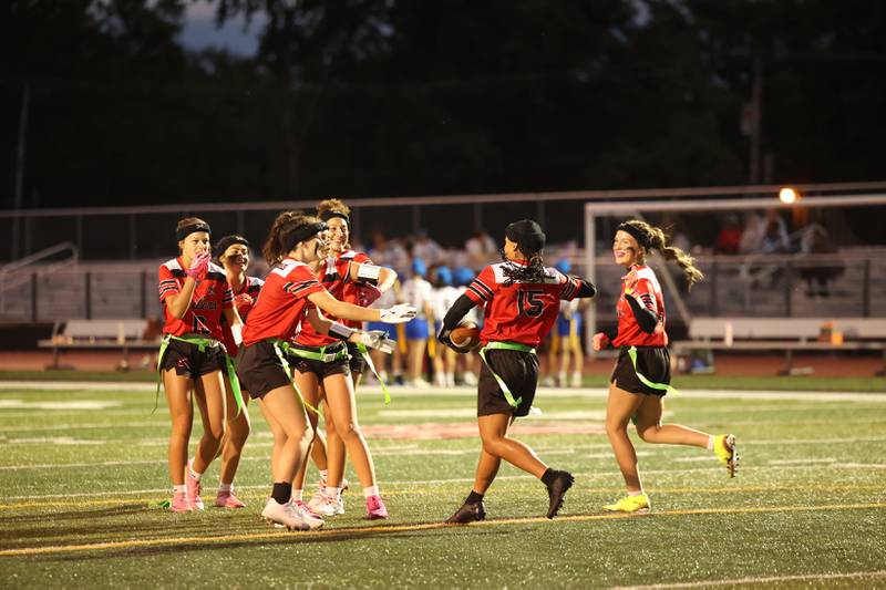 Bradley-Bourbonnais teammates celebrate a touchdown by Neveah Brown (15) during the Boilermakers' 60-7 victory over Joliet Central in the season opener on Aug. 25, 2025.