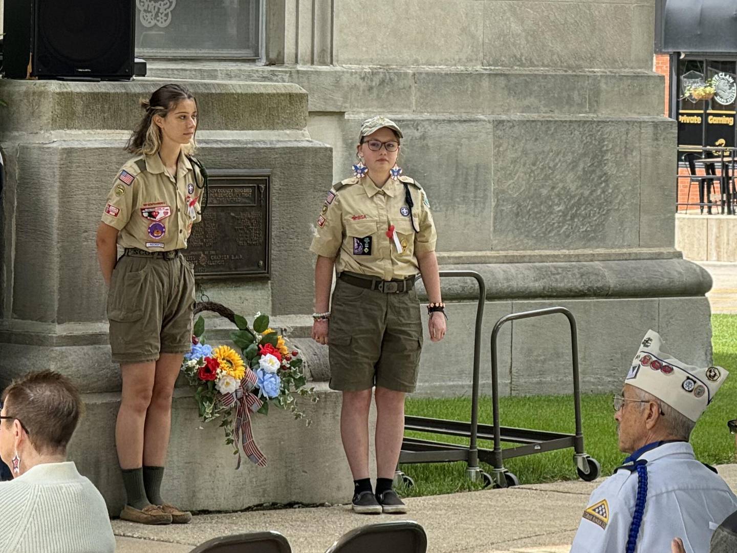 Girls lay the wreath for the Morris VFW Post 6049 Auxiliary, honoring the fallen.