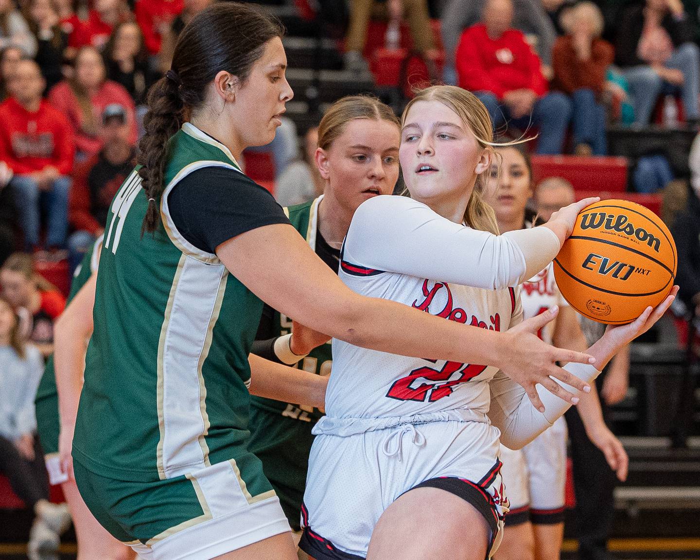 Hall’s Ava Delphi (21) holds ball as St. Bede’s Hanna Waszkowiak (44) defends on Saturday, January 31, 2026 at Hall High School in Spring Valley.
