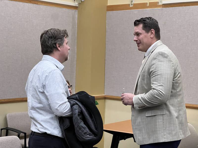 DeKalb County Rehab and Nursing Center Administrator Bart Becker, left, talks with DeKalb County Administrator Brian Gregory before the Dec. 6, 2023 DeKalb County Committee of the Whole meeting.