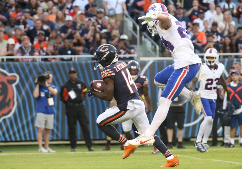 Chicago Bears wide receiver Olamide Zaccheaus, sprints ahead of Buffalo Bills safety Cole Bishop on Sunday, Aug. 17, 2025 at Soldier Field in Chicago.