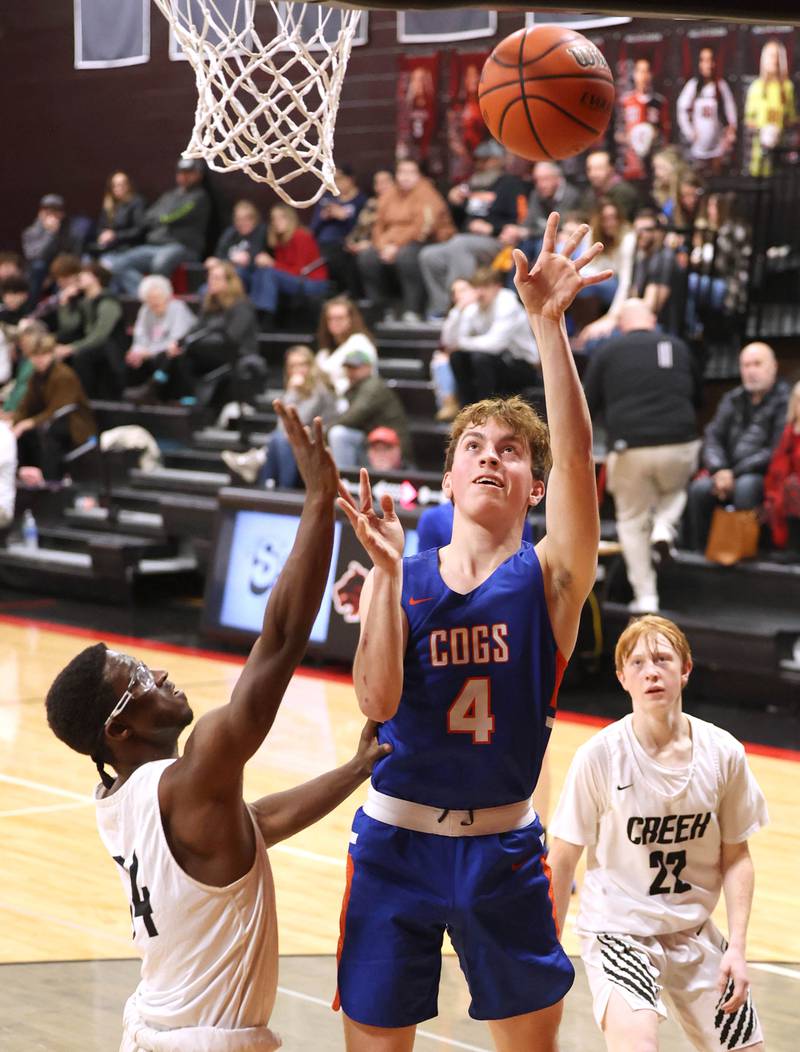 Genoa-Kingston's Ethan Vasak shoots over an Indian Creek defender Wednesday, Jan. 25, 2023, during their game at Indian Creek High School in Shabbona.