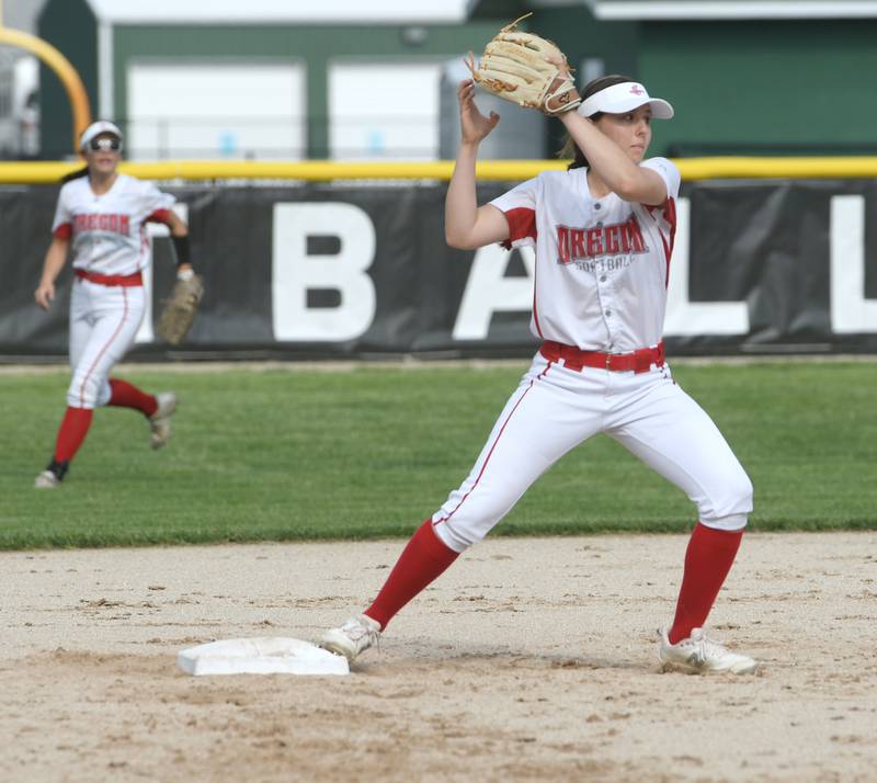 Oregon's Jesse Suter catches the ball and steps on second base for the force out before throwing to first in attempt for a double play against Byron at the 1A Rock Falls Regional on Wednesday, May 18. The Hawks beat the Tigers 8-0 to advance to the regional championship on Friday.