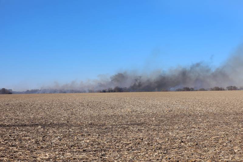 Thick black smoke can be seen near the 26000 block of 2500 East Street on Wednesday, Feb. 18, 2026 near Ohio. A Mutual Aid Box Alarm call was elevated to the second-alarm for the brush fire. Bureau County Fire departments from Princeton, Ohio, Malden and others assisted with the fire.
