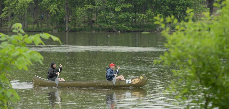 Canoeist paddle down the Fox River in Geneva during the annual Mid-American Canoe & Kayak Race on Saturday, June 1, 2024.