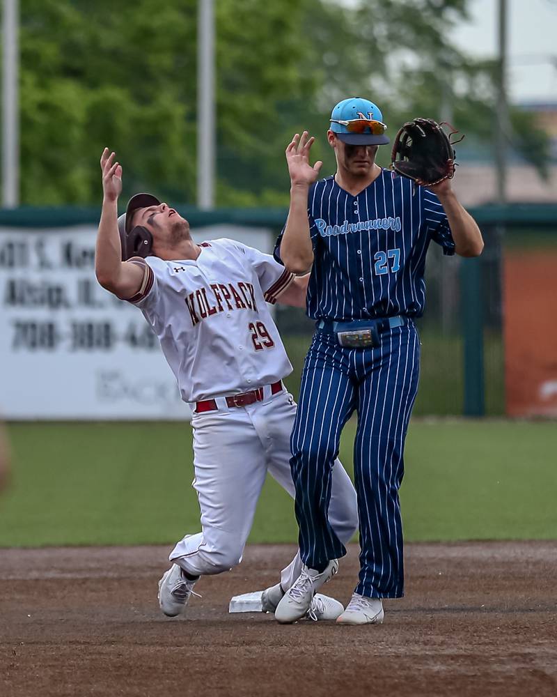 St. Ignatius Corbin Klein (29) collides with Nazareth's David Cox (27) at second during the Class 3A Crestwood Supersectional game between St. Ignatius at Nazareth.  June 6, 2022.