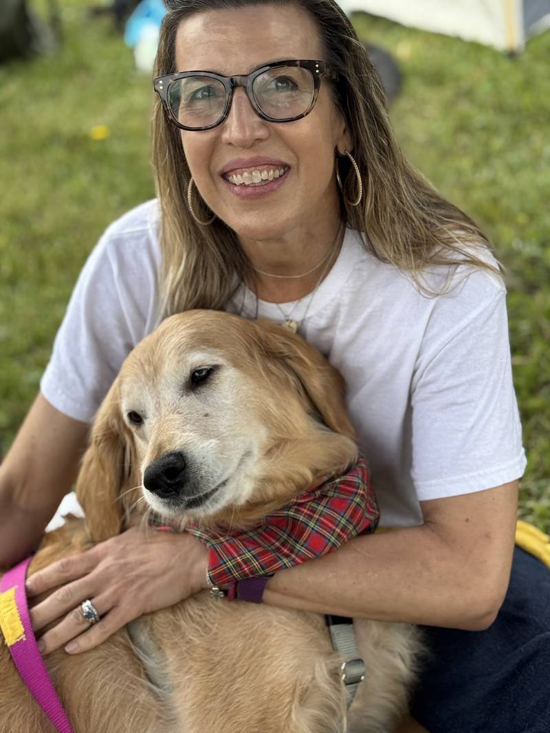 Denise Samuel with her foster dog Nutmeg, 6, from As Good As Gold - Golden Retriever Rescue of Illinois.