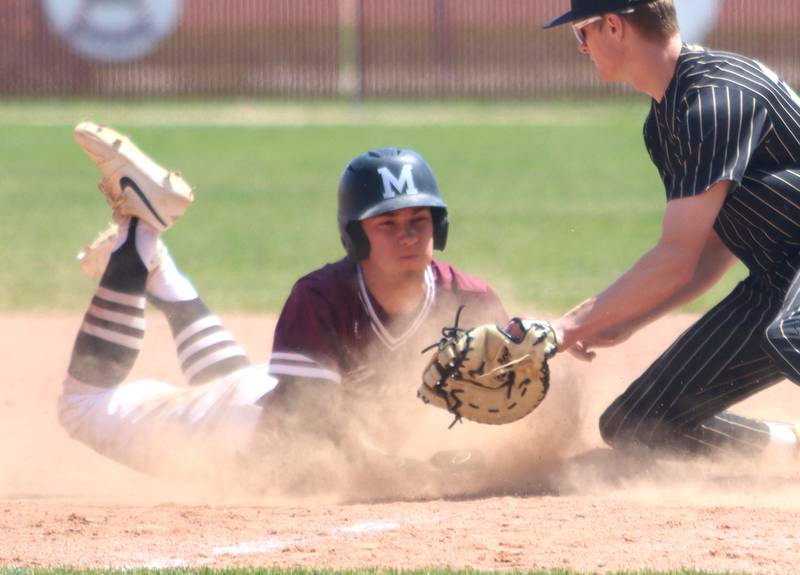 Marengo’s Robert Heuser scrambles back safely to first base against Rockford Christian in IHSA Class 2A Regional Title Game action baseball at Richmond-Burton High School in Richmond  on Saturday, May 24, 2025.