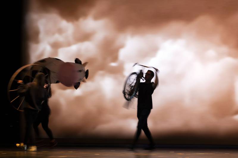 Cast members rehearse the tornado scene Wednesday, April 9, 2025, as they prepare for Newman High School's performances of “The Wizard of Oz.”
