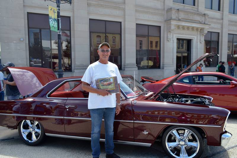 Mark Heckman, of Dixon, poses in front of the 1966 Chevrolet Nova he and his wife, Sandy Heckman, entered in the 33rd annual Polo Car Show on Aug. 13. The vehicle won Best in Show.