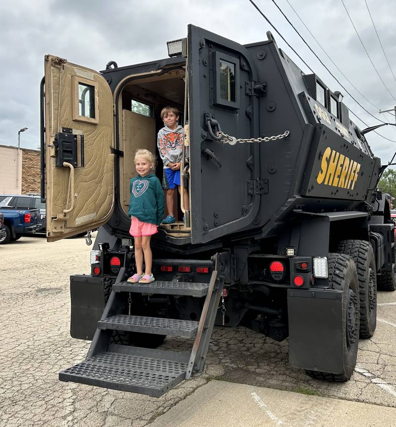 Everly McCarty, 6, and Gage Frisk, 6, of Byron, toured one of the Ogle County Sheriff Department's big trucks during National Night Out in Byron on Tuesday, Aug. 6, 2024. The event was held in conjunction with the Byron fire and police departments.