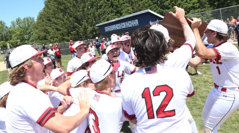 Members of the Hall baseball team celebrate after defeating Sherrard during the Class 2A Sectional final game on Saturday, May 27, 2023 at Knoxville High School.