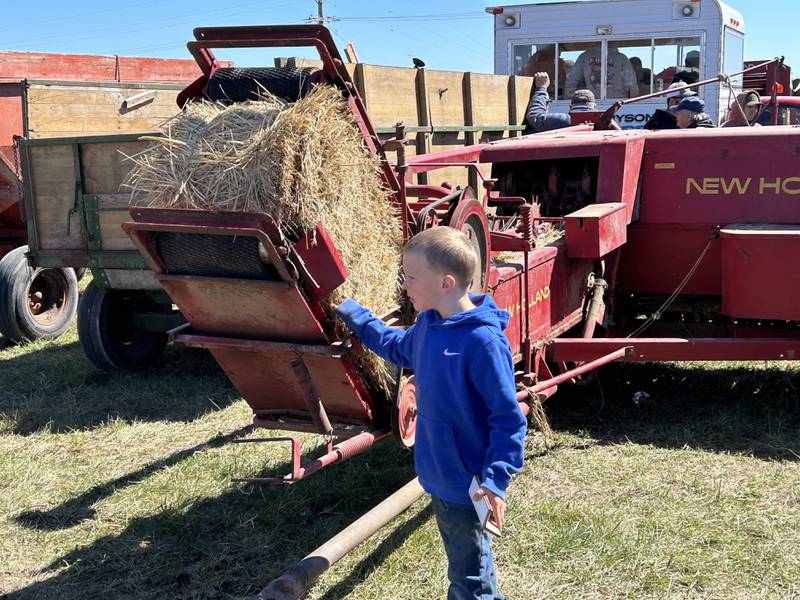 Cayson Wolf, 5, of Dixon, checks out a hay baler at the Hazelhurst Annual Spring Consignment Auction Saturday, April 6, 2024. Cayson was at the sale with his dad. The annual event is held each year on a farm along Milledgeville Road, between Polo and Milledgeville.