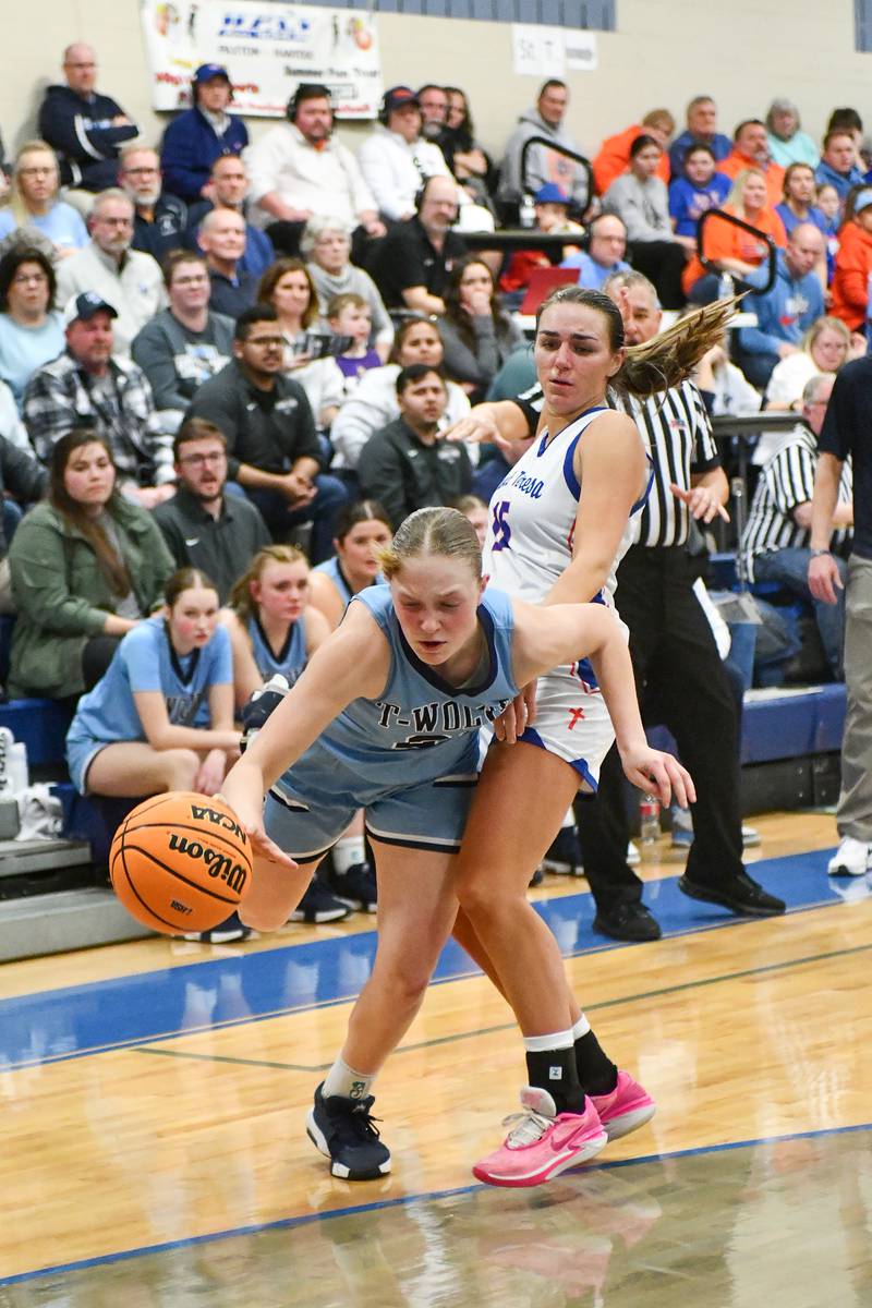 Cissna Park's Josie Neukomm drives around St. Teresa's Lucy Corley during the Timberwolves' 47-35 victory over St. Teresa in the IHSA Class 1A Blue Ridge Super-Sectional on Monday, March 3.