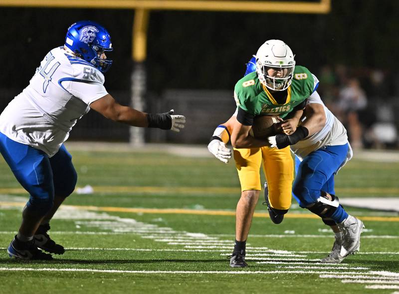 Providence Catholic's Tyler Payne (8) tries to scrambles during the non-conference game against St. Francis on Friday, SEP. 26, 2025, at New Lenox.